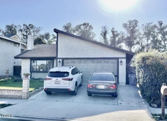 1966 Sutter Place Oxnard, CA 93033 - Photo 2 of 19 a car parked in front of white house