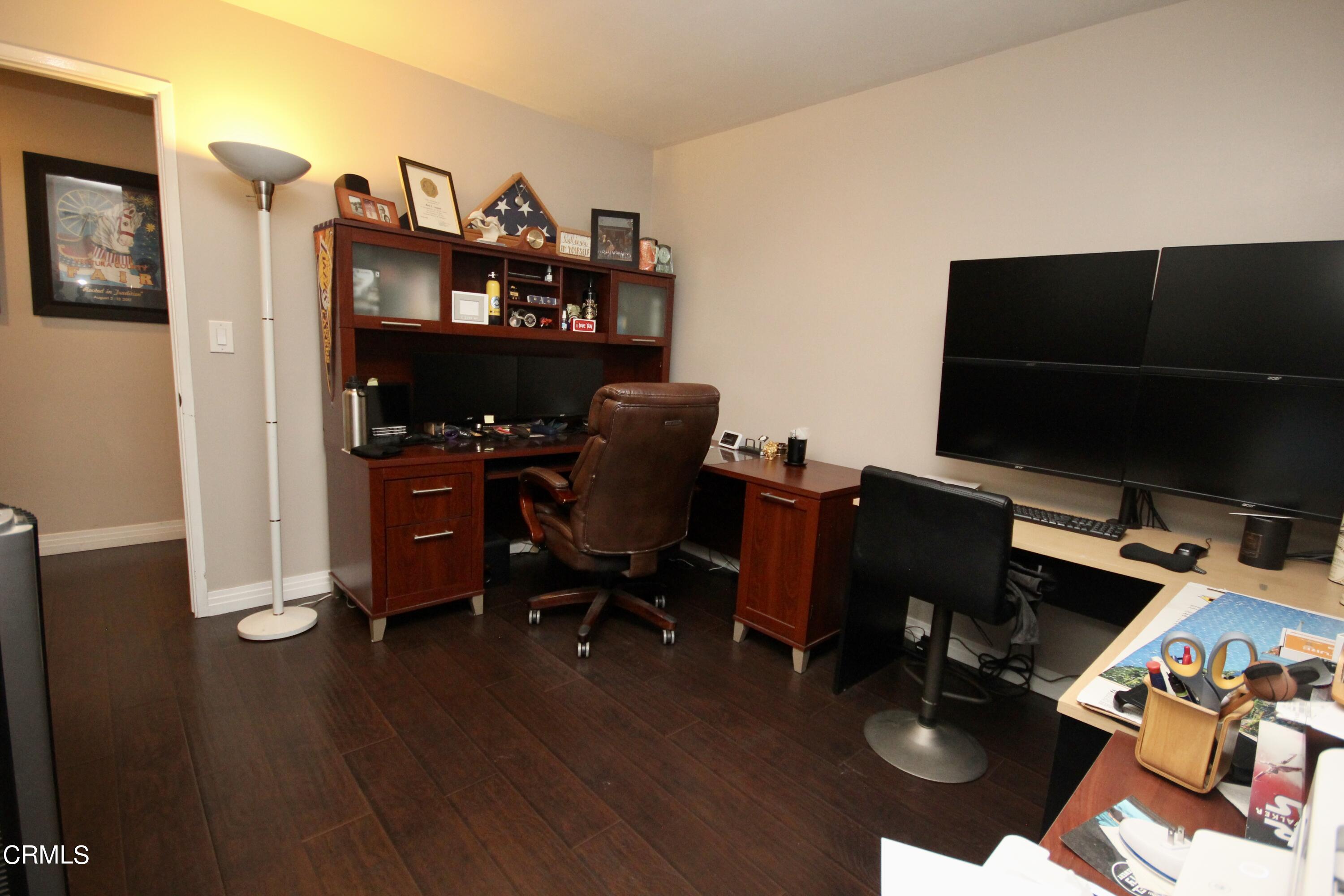 1966 Sutter Place Oxnard, CA 93033 - Photo 13 of 19 a view of a workspace with furniture and wooden floor