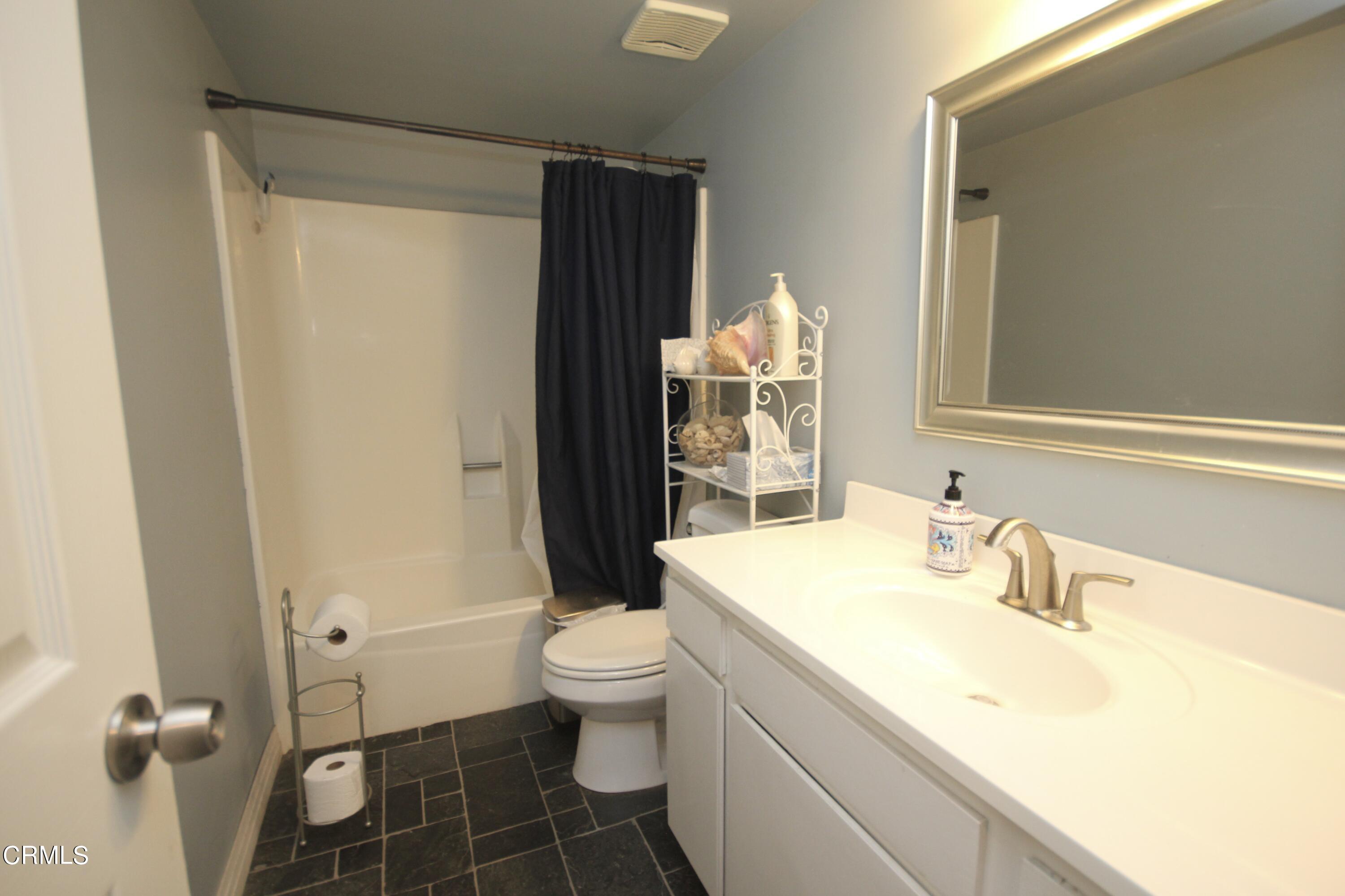 1966 Sutter Place Oxnard, CA 93033 - Photo 14 of 19 a bathroom with a sink toilet and shower
