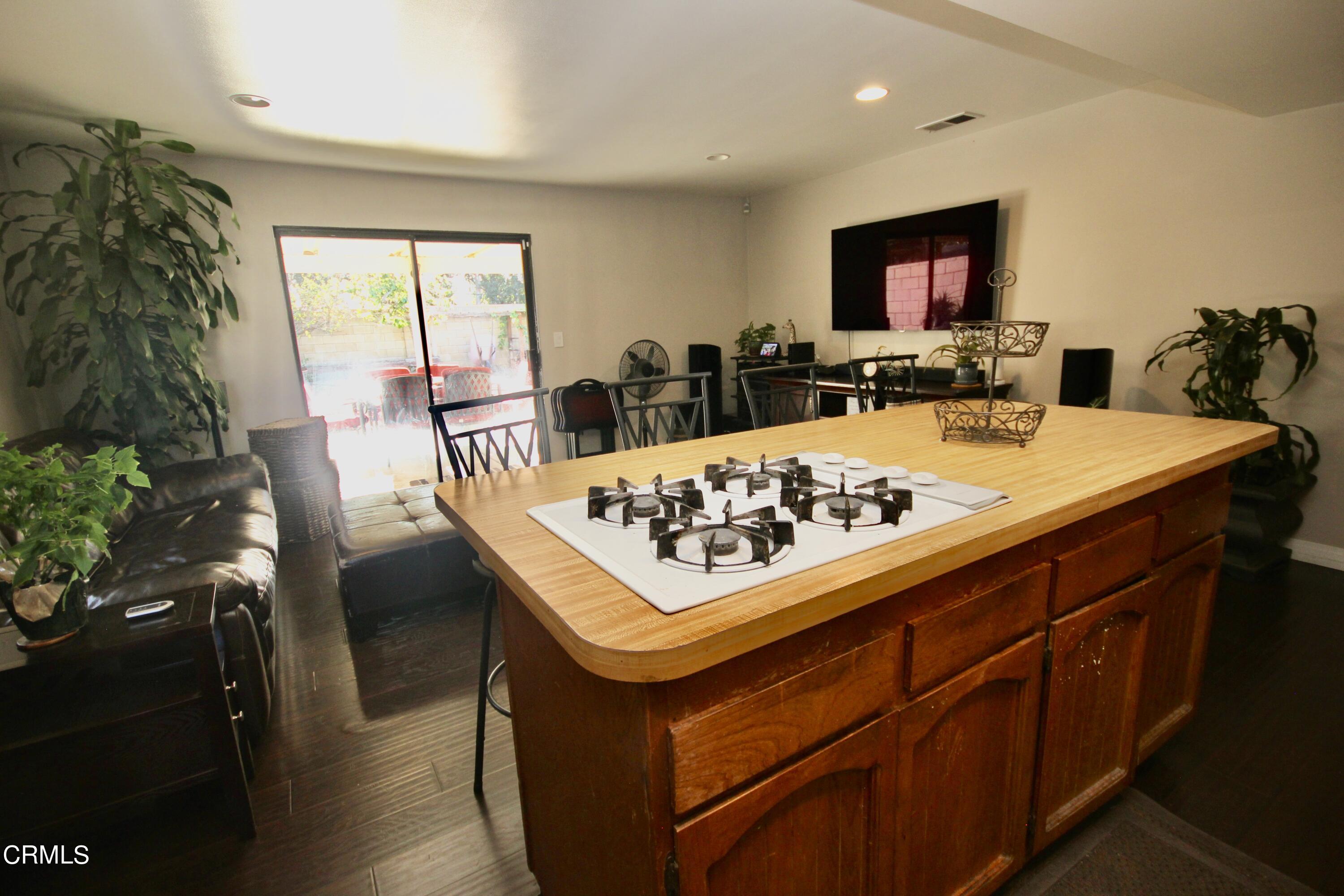 1966 Sutter Place Oxnard, CA 93033 - Photo 9 of 19 a view of a dining table and chairs in a room