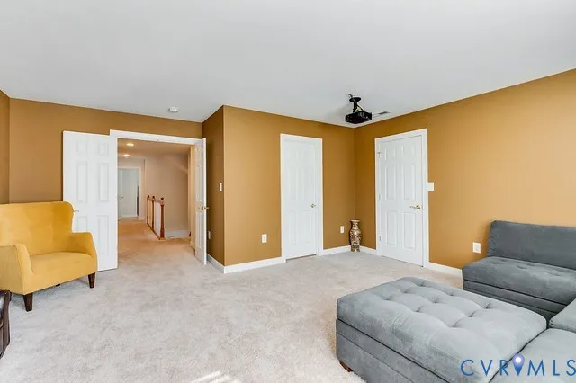 a bedroom with furniture and a walk in closet