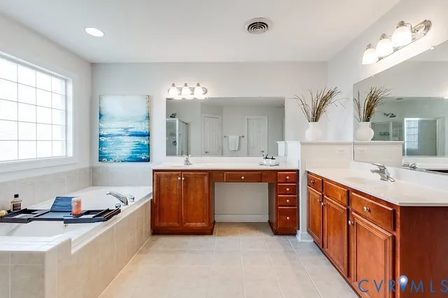 a large kitchen with stainless steel appliances a sink a stove and a window