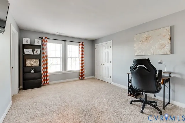 a view of workspace with furniture and window