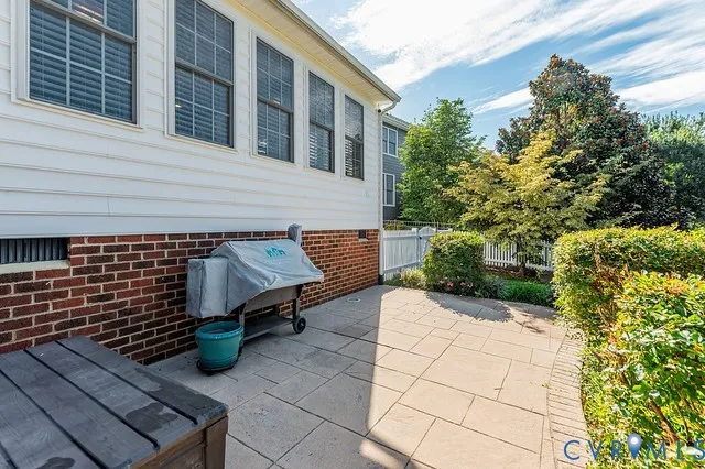a view of a backyard with sitting area