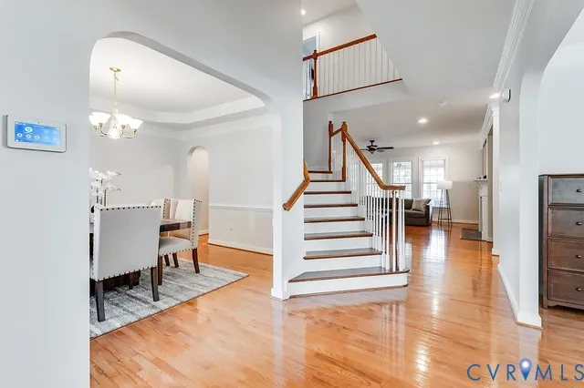 a view of entryway and hall with wooden floor