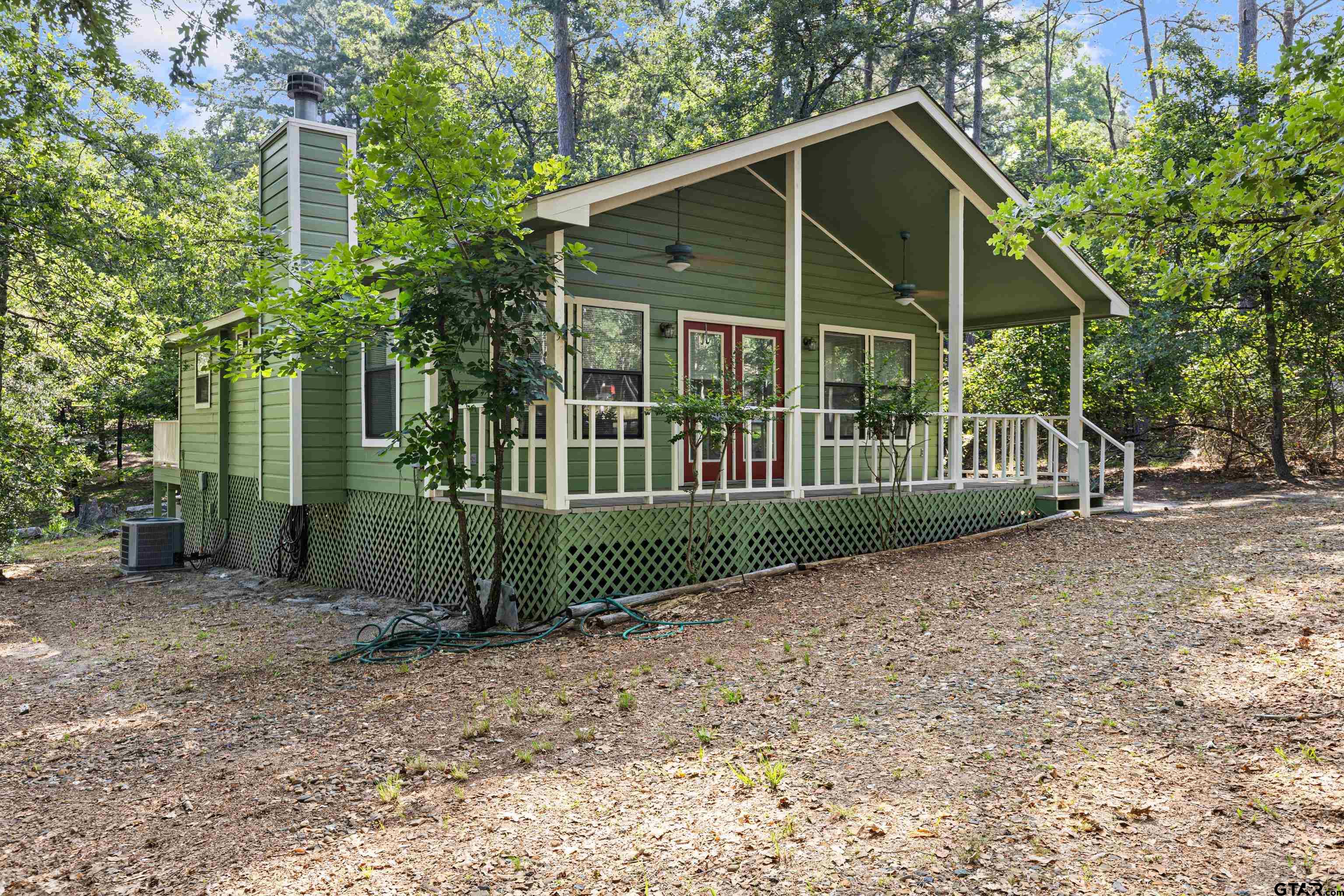 a view of a house with a small yard and plants