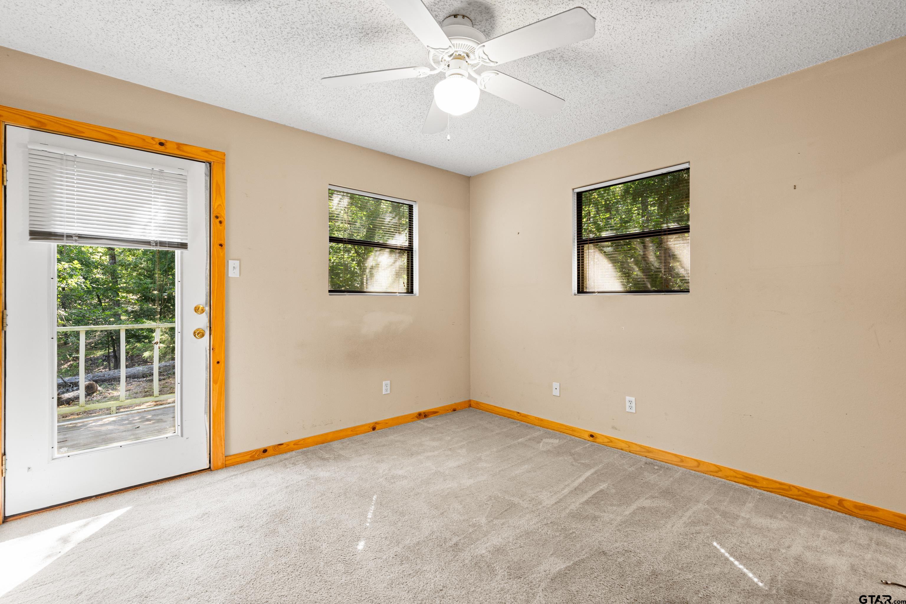 149 Primrose Path Holly Lake Ranch, TX 75765 - Photo 17 of 36 a view of an empty room with a window