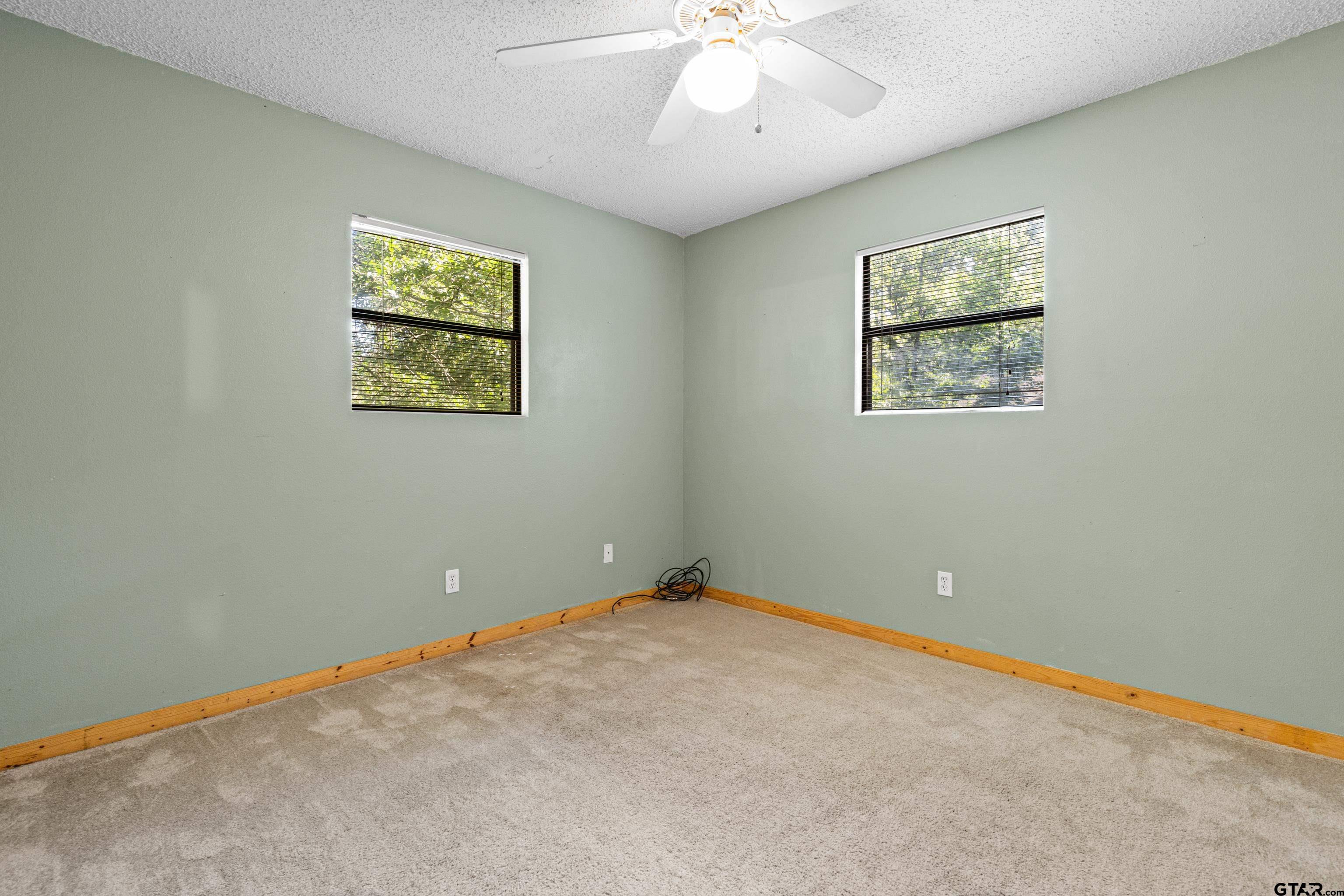 149 Primrose Path Holly Lake Ranch, TX 75765 - Photo 19 of 36 a view of an empty room with a window