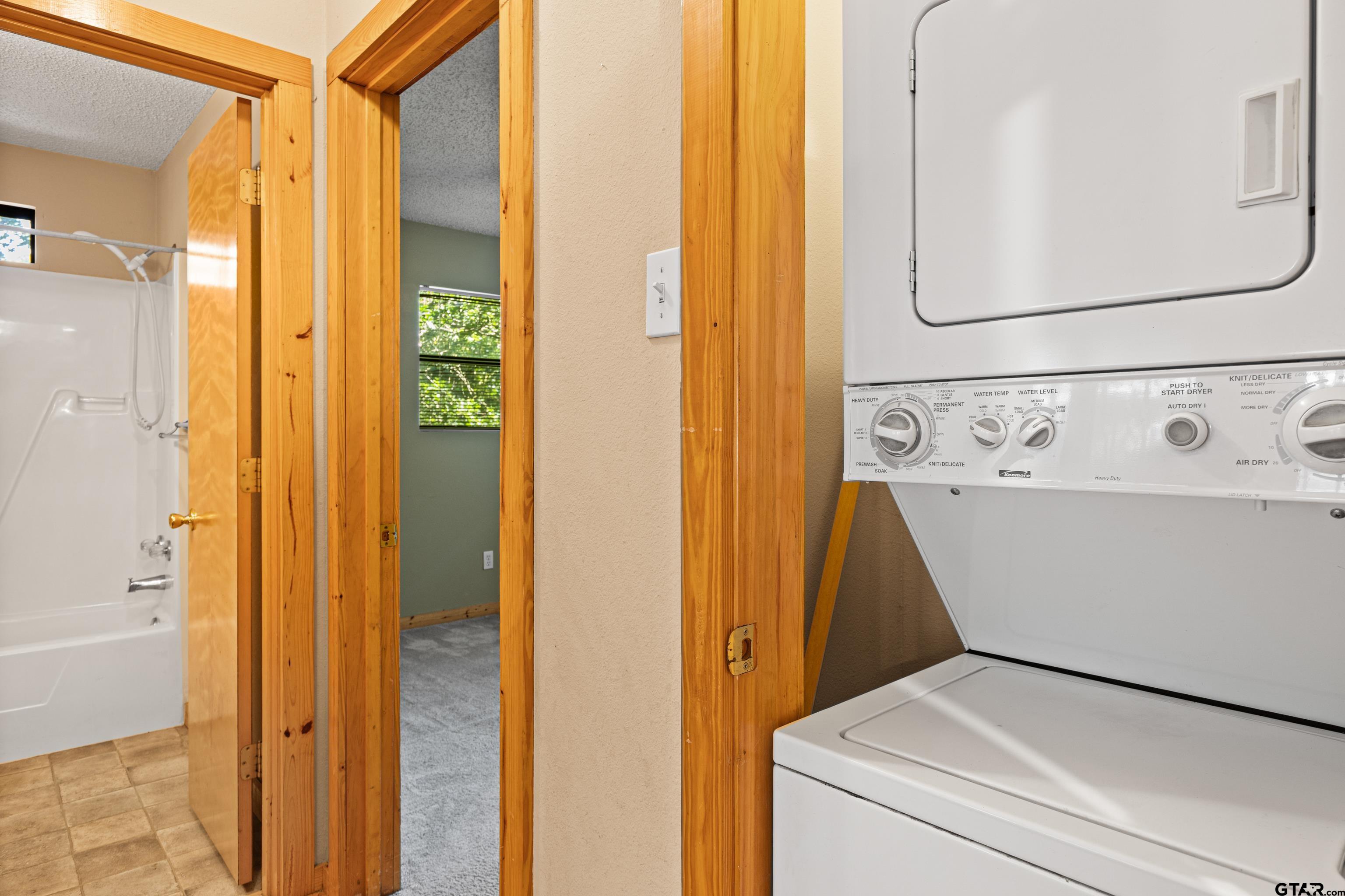 149 Primrose Path Holly Lake Ranch, TX 75765 - Photo 21 of 36 a utility room with dryer and washer