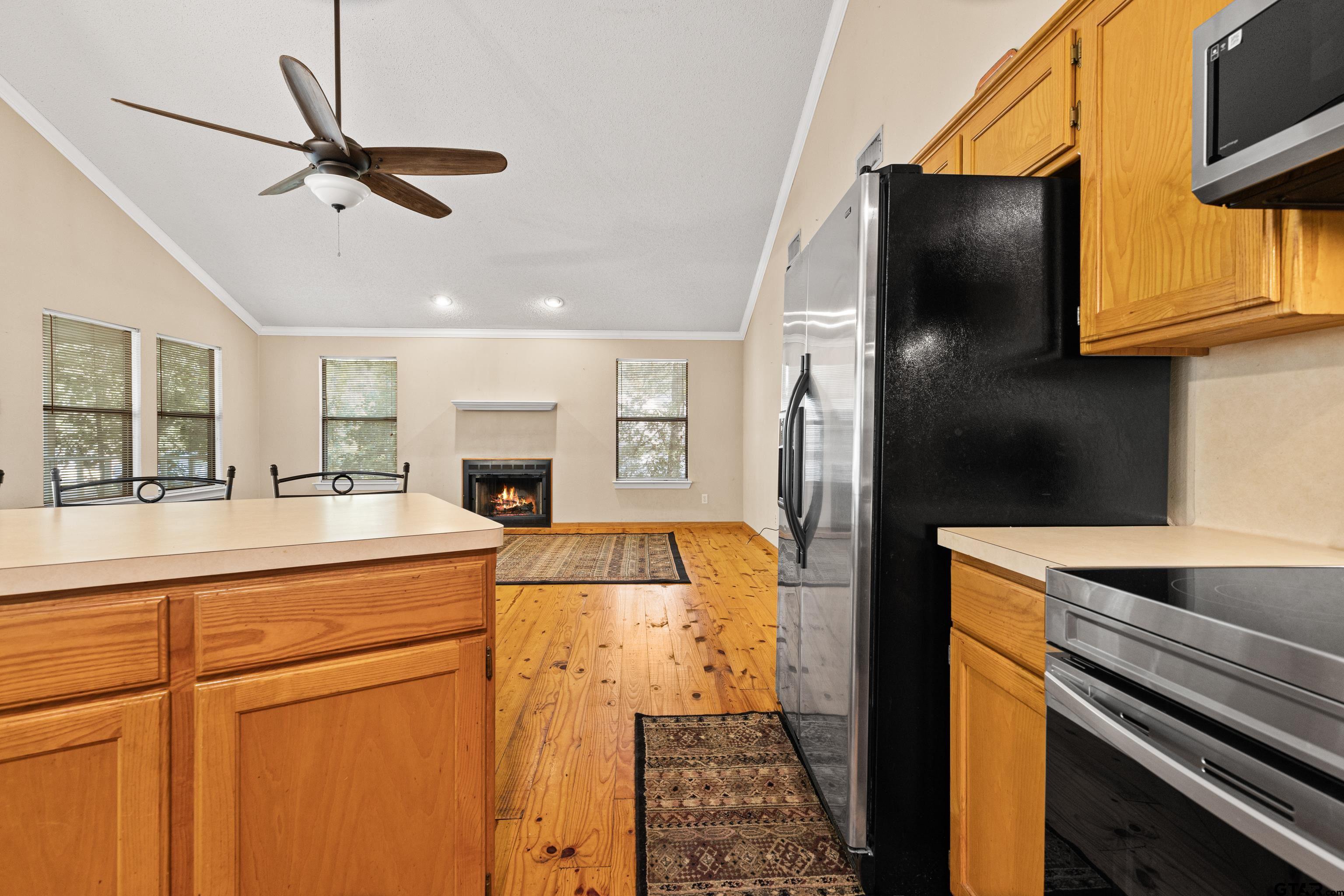 149 Primrose Path Holly Lake Ranch, TX 75765 - Photo 25 of 36 a kitchen with a refrigerator and a sink