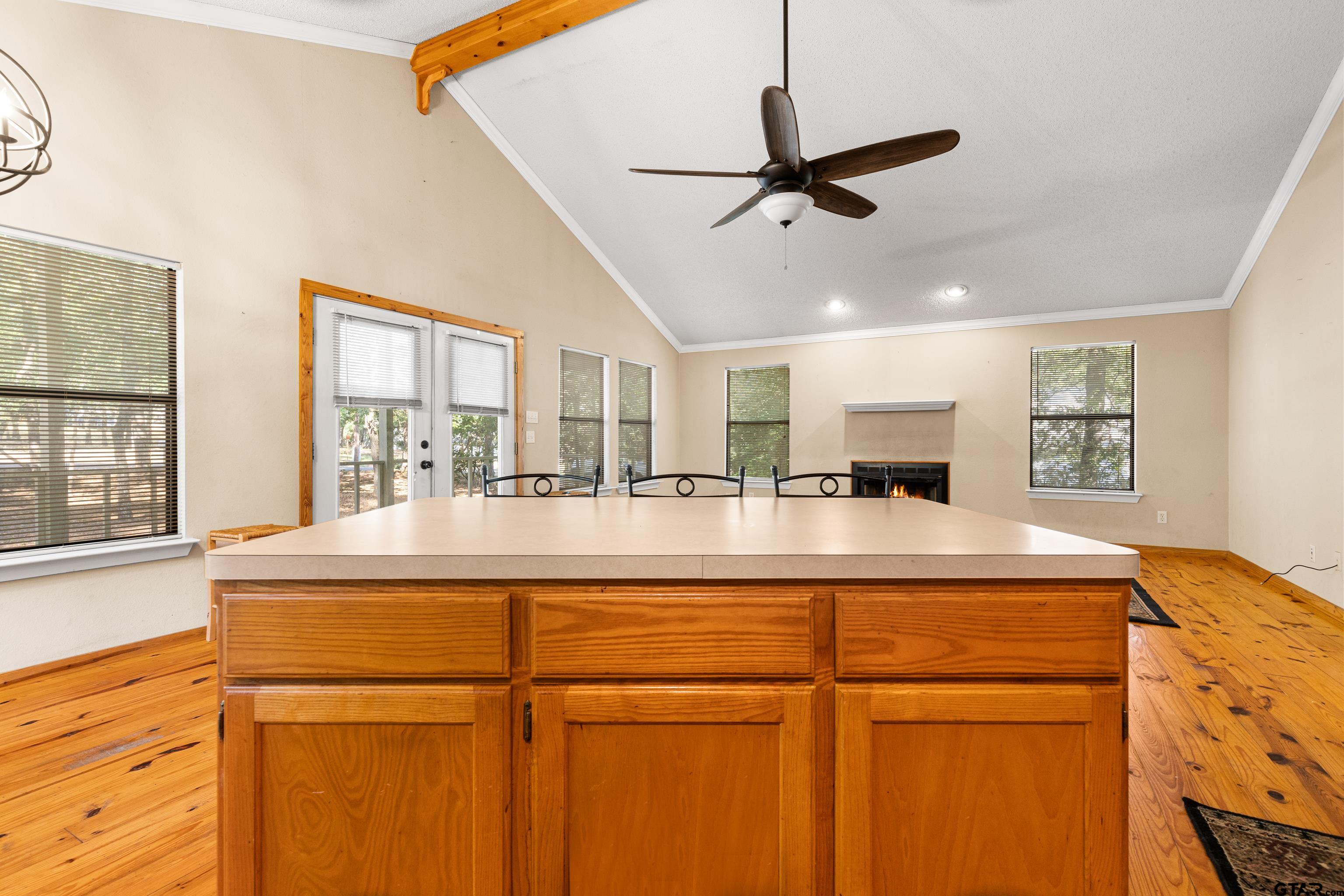 149 Primrose Path Holly Lake Ranch, TX 75765 - Photo 26 of 36 a living room with stainless steel appliances kitchen island a large window and a sink
