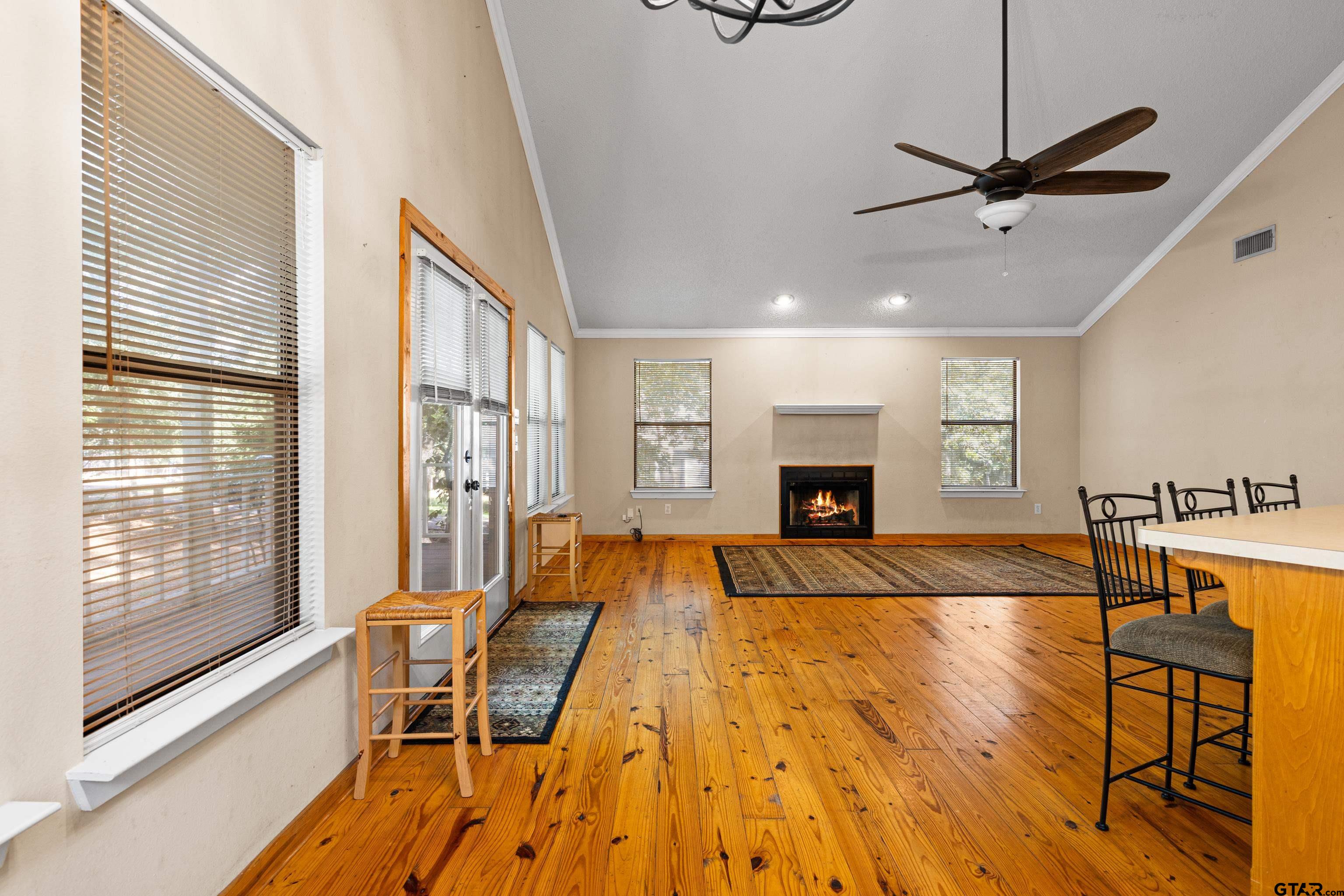 149 Primrose Path Holly Lake Ranch, TX 75765 - Photo 29 of 36 a living room with furniture and a fireplace