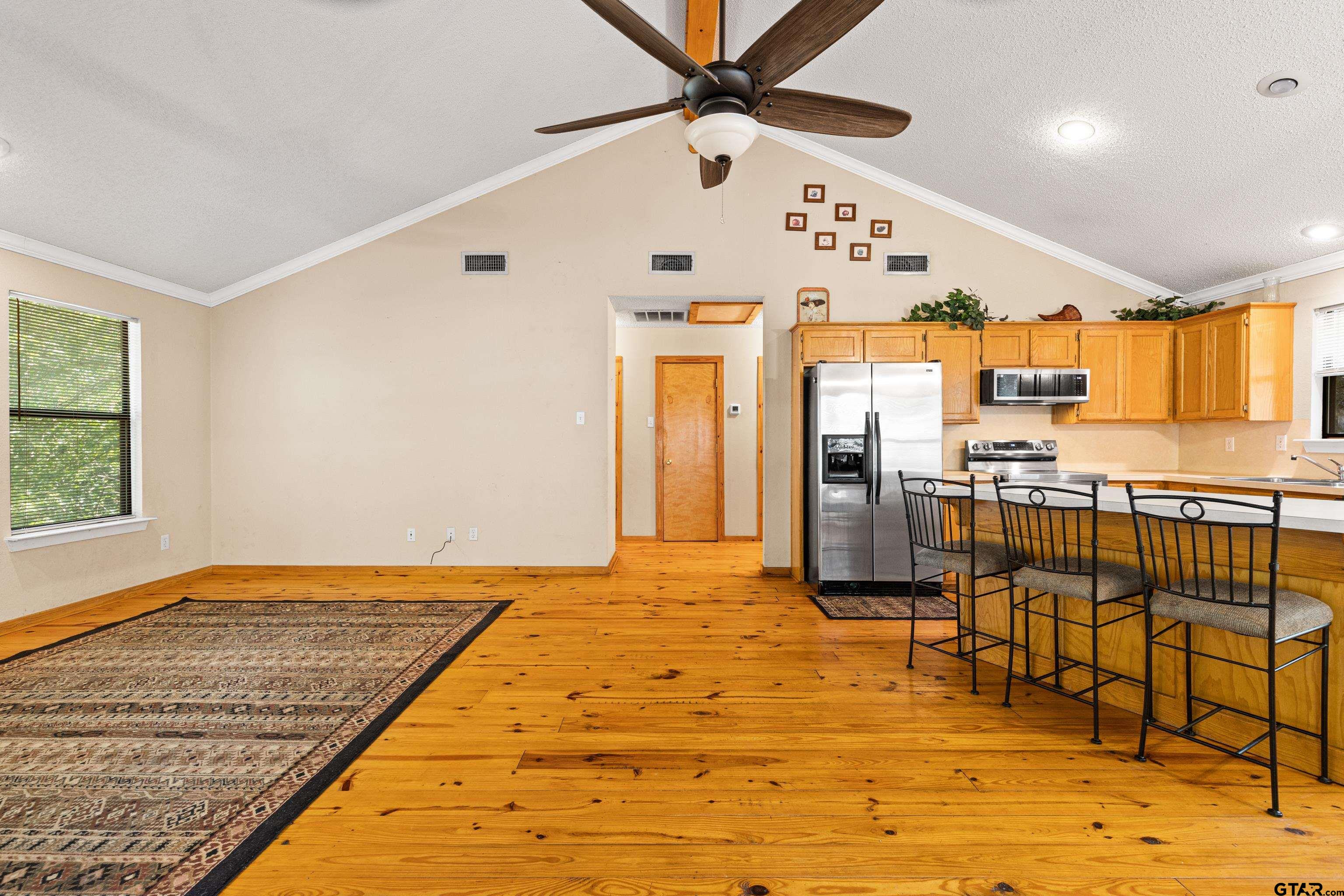 149 Primrose Path Holly Lake Ranch, TX 75765 - Photo 34 of 36 a view of a living room and kitchen