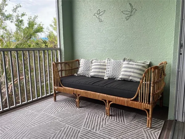 a wooden bench sitting in front of a door