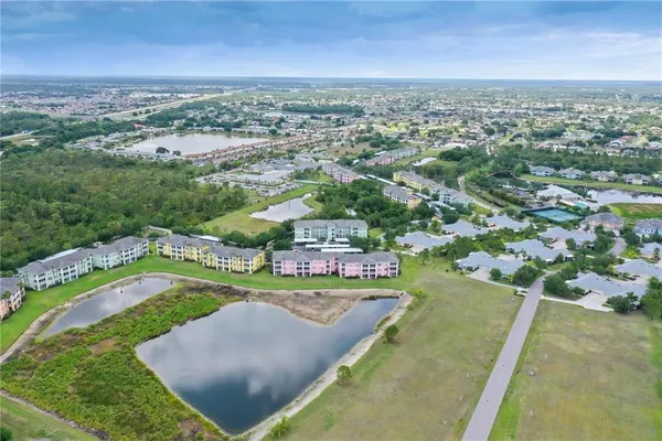 an aerial view of a house with a swimming pool
