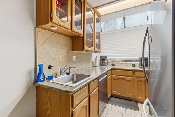 a utility room with a sink a washer and dryer
