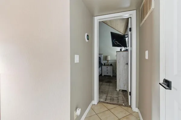 a view of a bathroom from a hallway