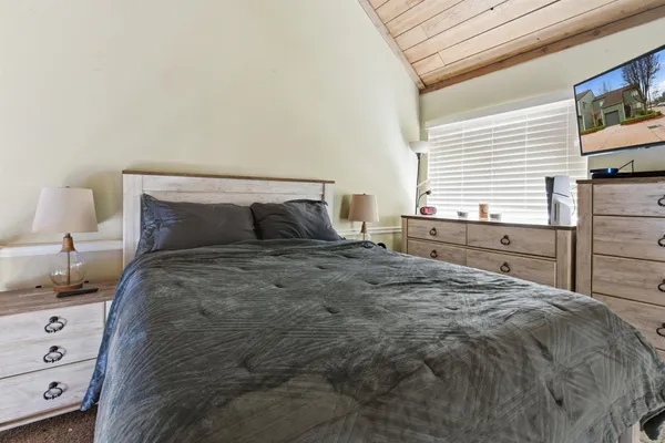 a bedroom with a bed and a closet