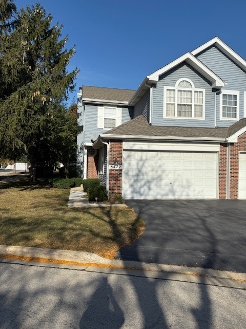 5412 Teaberry Court, Unit 5412 Rolling Meadows, IL 60008 - Photo 1 of 12 a view of a house with a yard