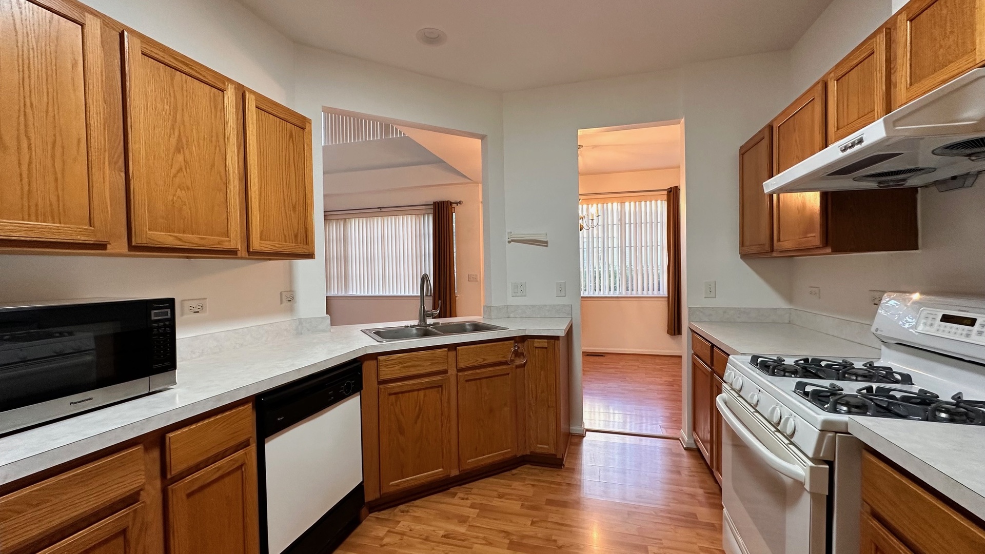 5412 Teaberry Court, Unit 5412 Rolling Meadows, IL 60008 - Photo 12 of 12 a kitchen with stainless steel appliances a stove a sink and a microwave