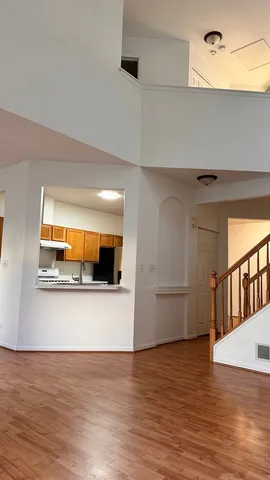 a view of a living room with a wooden floor