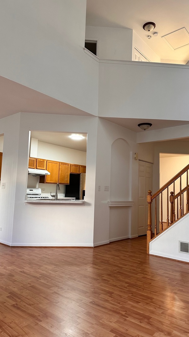 5412 Teaberry Court, Unit 5412 Rolling Meadows, IL 60008 - Photo 4 of 12 a view of a living room with a wooden floor
