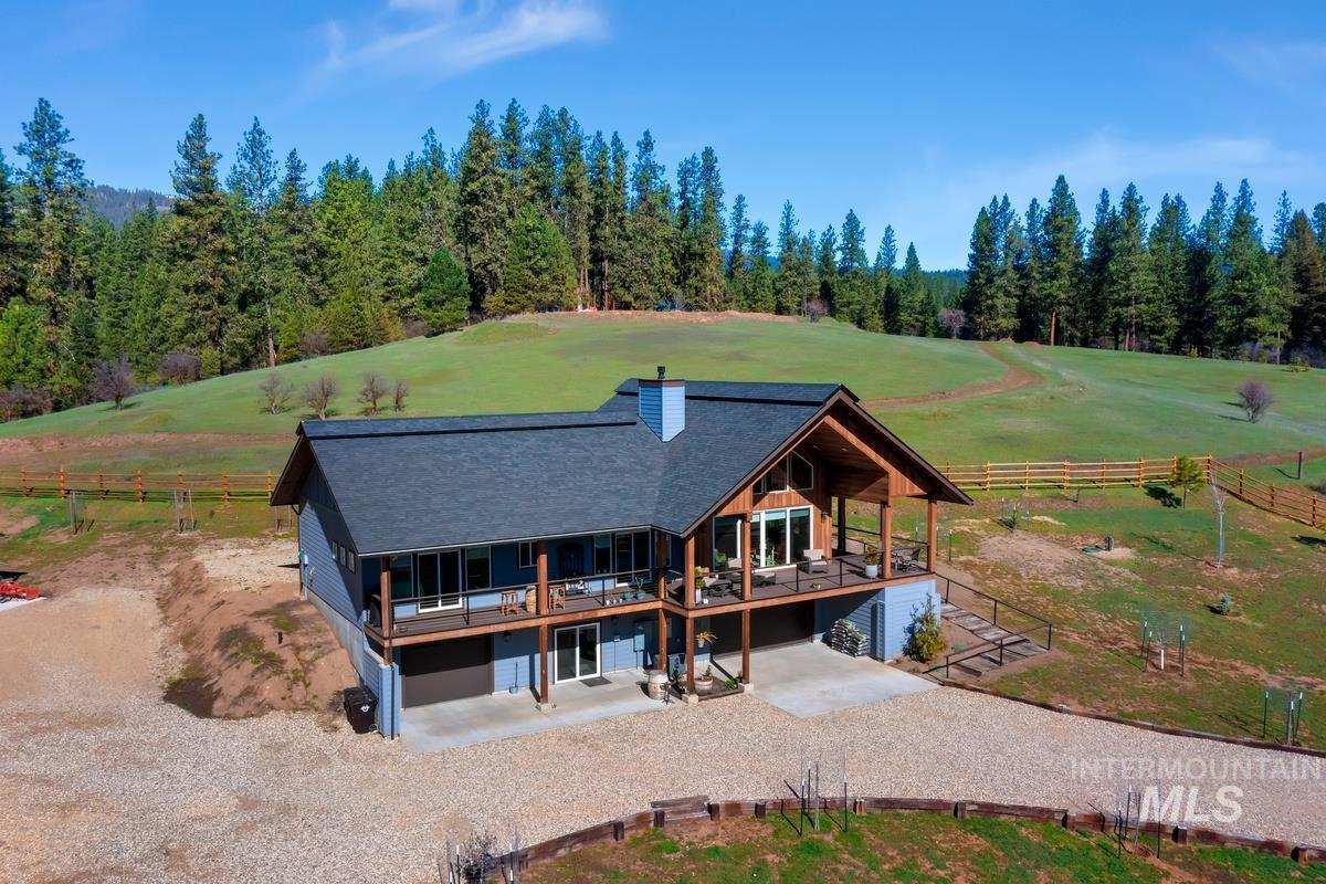 21 Open Road Garden Valley, ID 83622 - Photo 49 of 49 View of front of property featuring gravel driveway, a chimney, view of golf course, and roof with shingles