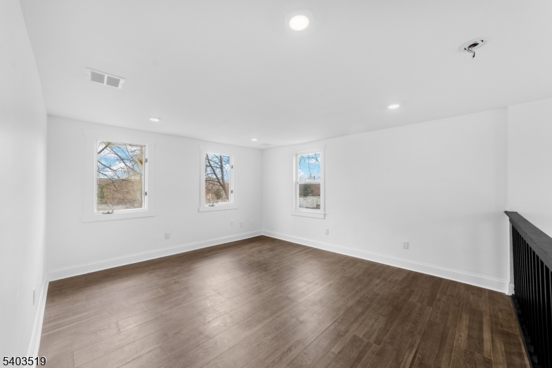 15 West Main Street Evesham, NJ 08053 - Photo 21 of 38 an empty room with wooden floor and windows