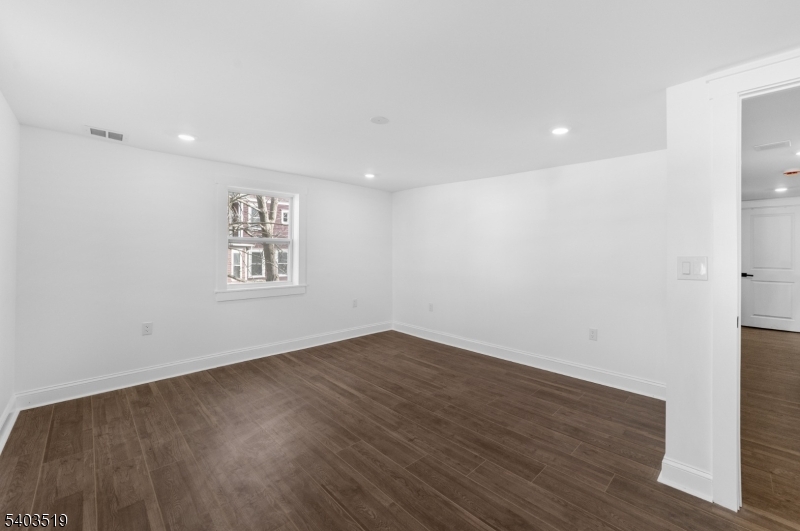 15 West Main Street Evesham, NJ 08053 - Photo 23 of 38 an empty room with wooden floor and windows