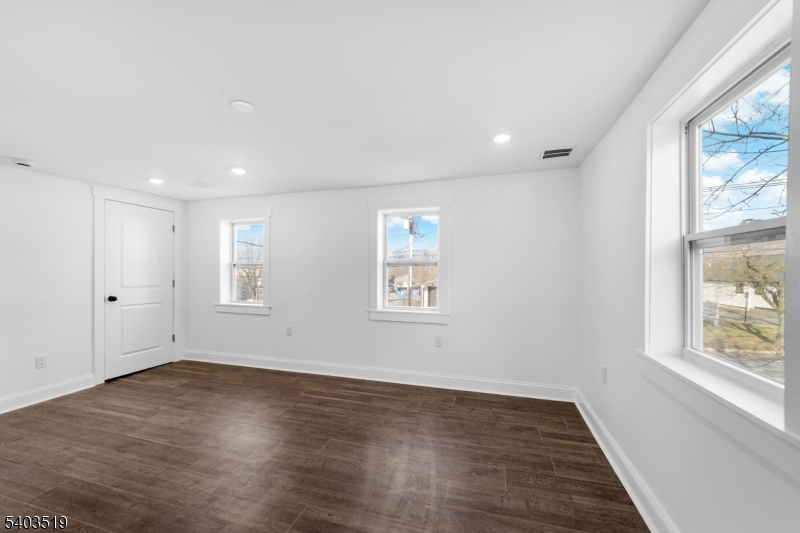 15 West Main Street Evesham, NJ 08053 - Photo 24 of 38 an empty room with wooden floor and windows