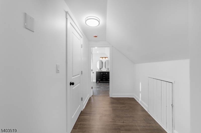 15 West Main Street Evesham, NJ 08053 - Photo 30 of 38 a view of a hallway with wooden floor and staircase