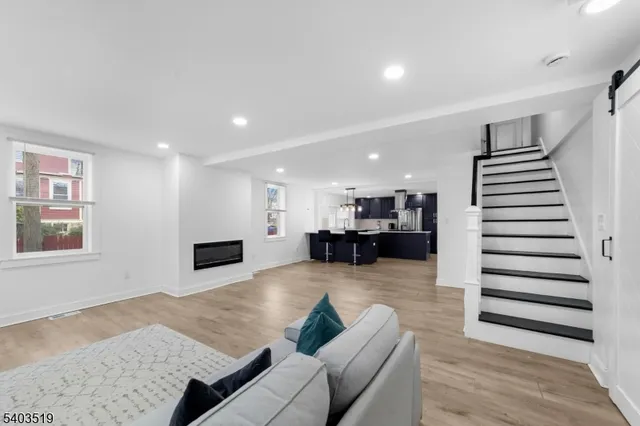 a room with a kitchen island a table and chairs in it
