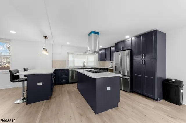 a kitchen with a sink and a refrigerator