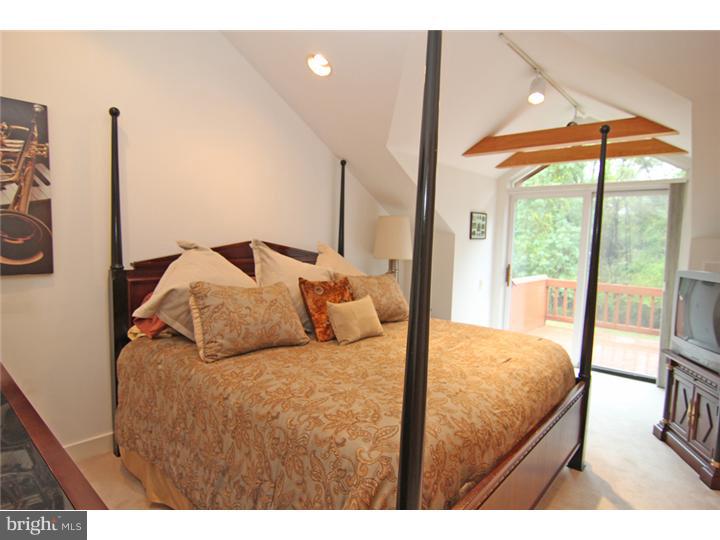 307 Oxford Road Villanova, PA 19085 - Photo 20 of 25 a bedroom with a bed and a large window