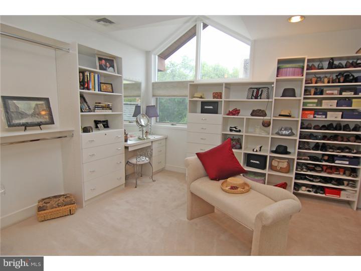 307 Oxford Road Villanova, PA 19085 - Photo 21 of 25 a living room with furniture cabinets and a window