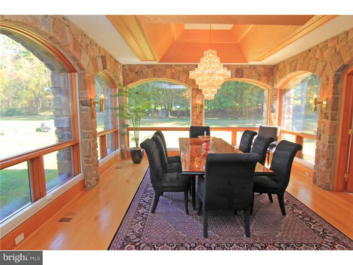 307 Oxford Road Villanova, PA 19085 - Photo 6 of 25 a dining room with furniture a chandelier and wooden floor