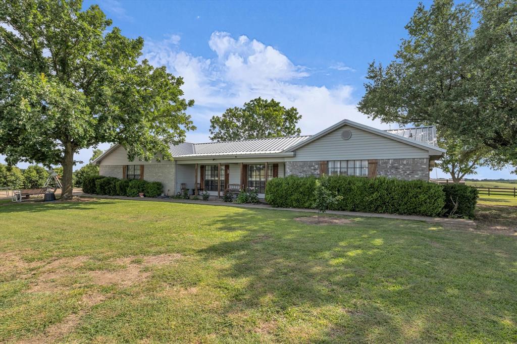 15796 Chapel Road Lorena, TX 76655 - Photo 20 of 34 a front view of a house with a garden