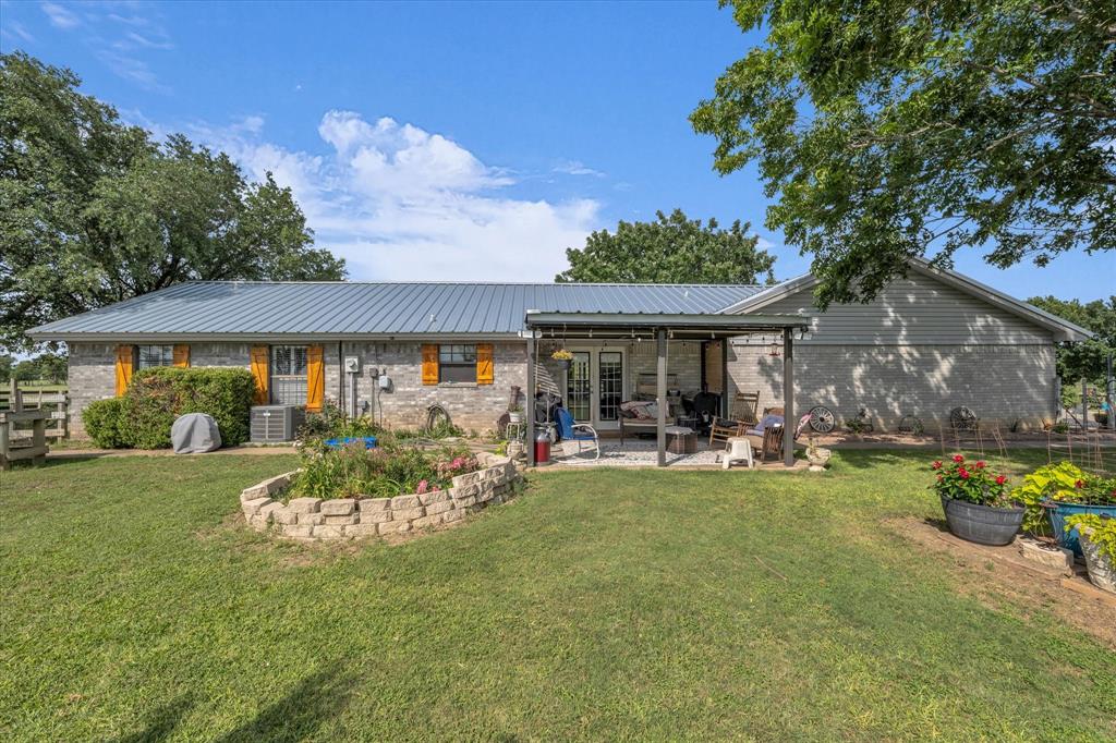 15796 Chapel Road Lorena, TX 76655 - Photo 21 of 34 a view of a house with backyard porch and sitting area