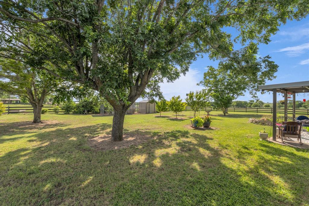 15796 Chapel Road Lorena, TX 76655 - Photo 22 of 34 a view of a yard with swimming pool