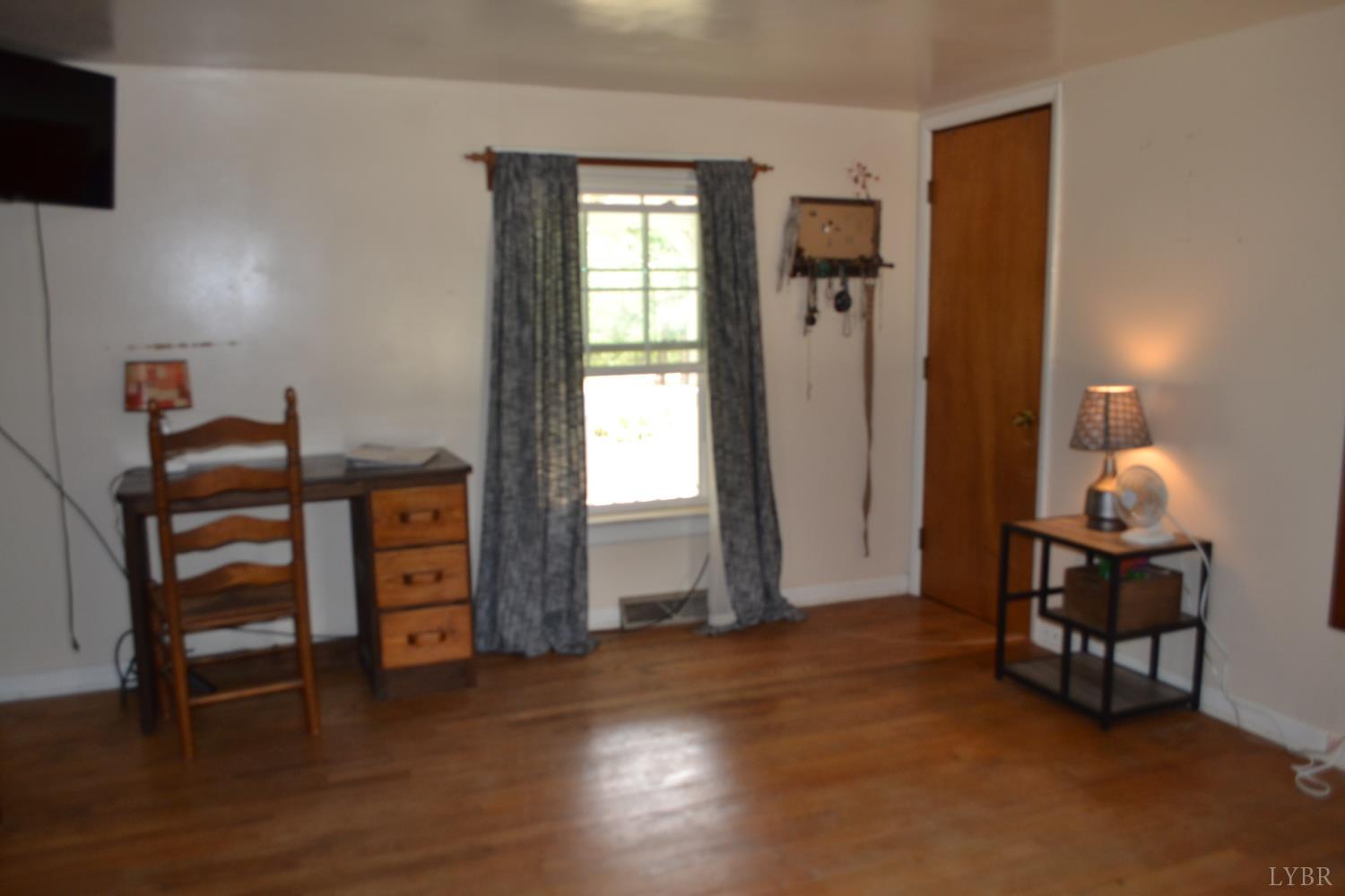 6387 Red House Road Rustburg, VA 24588 - Photo 24 of 38 a view of a livingroom with furniture and a window