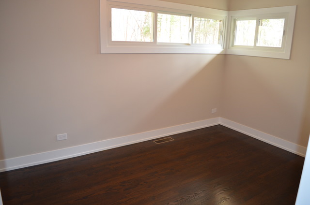 1130 Whitfield Road Northbrook, IL 60062 - Photo 13 of 25 an empty room with wooden floor and windows