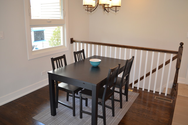 1130 Whitfield Road Northbrook, IL 60062 - Photo 5 of 25 a view of a dining room with furniture and wooden floor