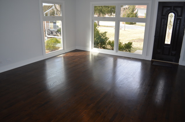 1130 Whitfield Road Northbrook, IL 60062 - Photo 7 of 25 a view of an empty room with wooden floor and a window
