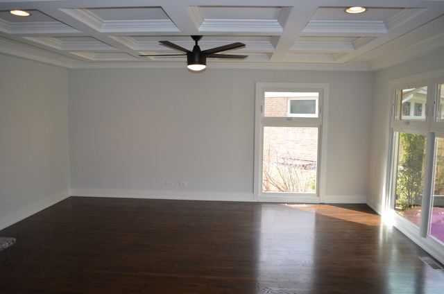 1130 Whitfield Road Northbrook, IL 60062 - Photo 8 of 25 an empty room with wooden floor fan and windows