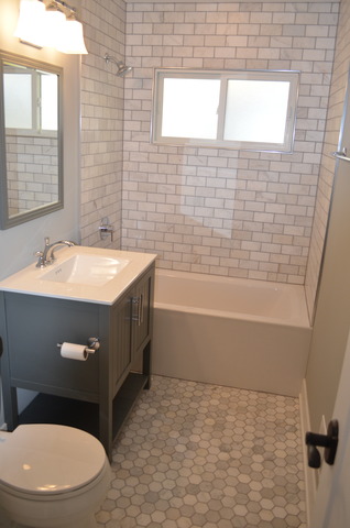 1130 Whitfield Road Northbrook, IL 60062 - Photo 10 of 25 a bathroom with a sink a toilet and shower