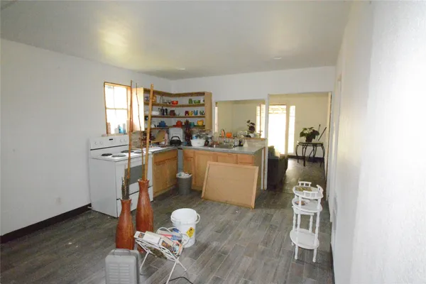 a room with furniture a wooden floor and a window