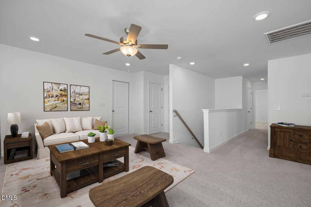 111 Crop Road Angier, NC 27501 - Photo 18 of 30 a living room with furniture and a ceiling fan