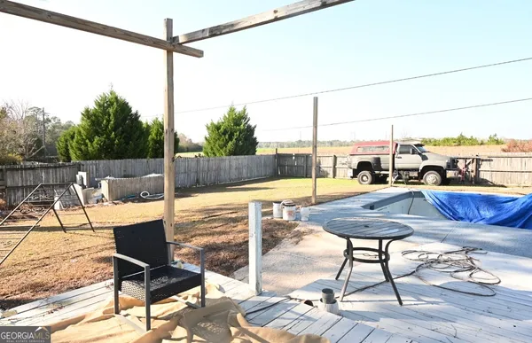a view of a chairs and table in the terrace