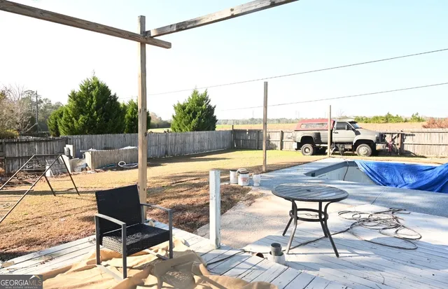 a view of a chairs and table in the terrace