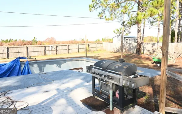 a view of a swimming pool with a lounge chairs